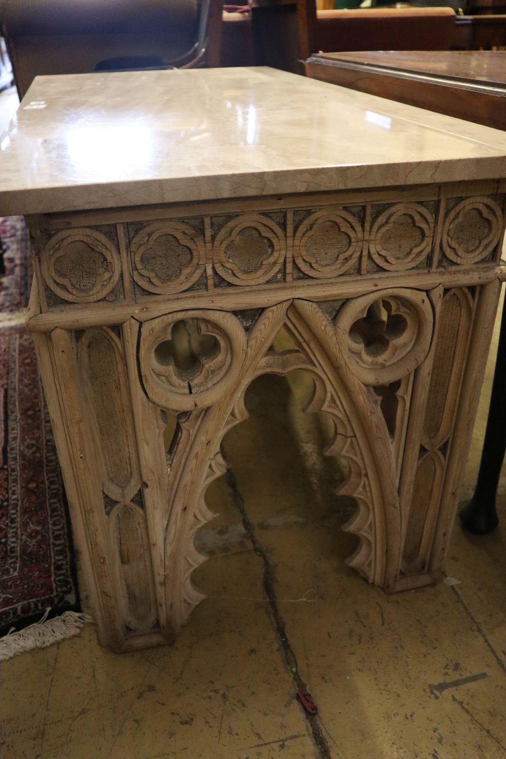 A Gothic style marble top bleached oak console table, width 122cm, depth 58cm, height 66cm